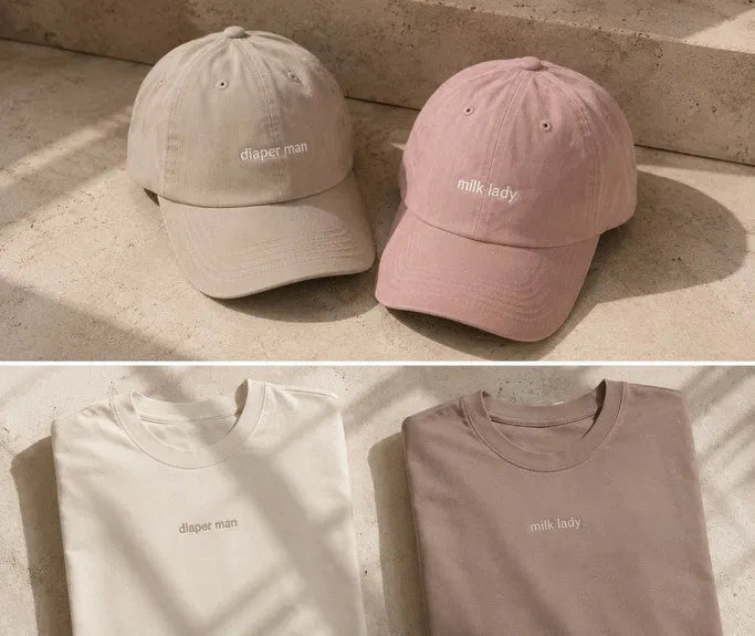 Diaper Man + Milk Lady matching set folded — caps and crewnecks together