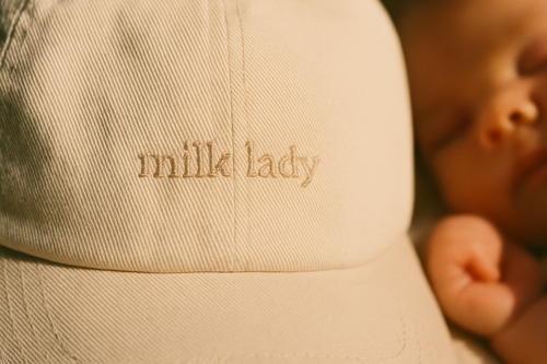 Milk Lady hat — tonal embroidery detail on stone dad hat